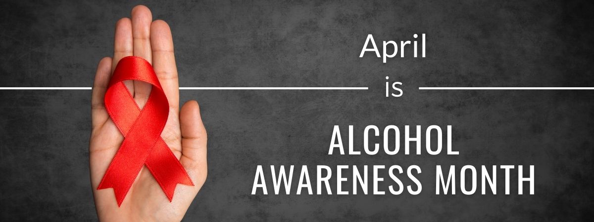april is alcohol awareness month with a hand hold a red remembrance ribbon
