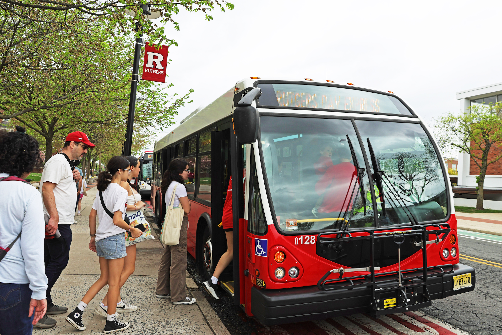 Rutgers Day attendees boarding the Rutgers Day Express bus