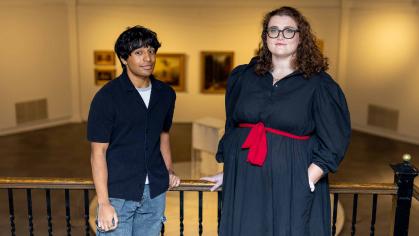 Rutgers students Roshan Kenath (left) and Megan Mauriello stand in the Art of the Americas Gallery at the Zimmerli Art Museum.