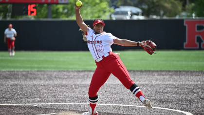 softball player throwing a ptich