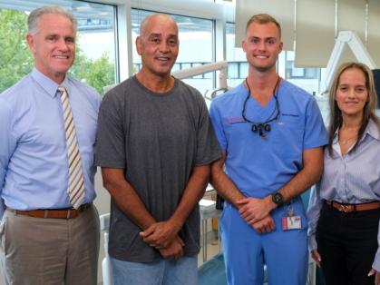 From left: John Moran, assistant professor of diagnostic sciences and group practice administrator for the Rutgers School of Dental Medicine; Vet Smiles patient Glenn Ford, a former Army medic; dental student Brett Chappell; and Patient Representative Marinelly Rodriguez. Photo by Anthony Grippa. 