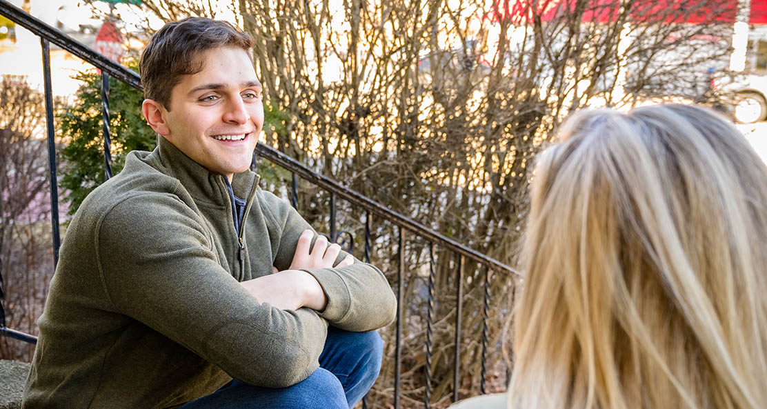 woman and man chatting on the steps outside before attending narcotics detox at Sunrise Detox Cherry Hill