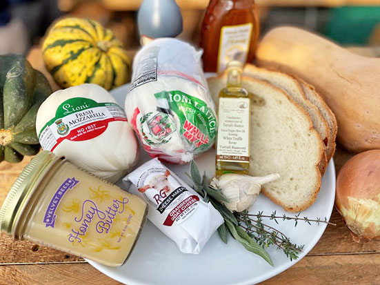 Photo by Alstede Farms on December 30, 2025. May be an image of baguette, salami, mozzarella, butter, squash and text.