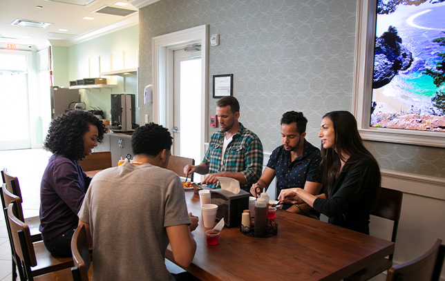 Group of patients enjoying meal time together