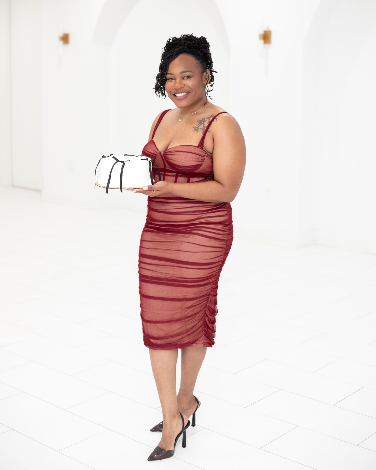 May be an image of one or more people, dress and text