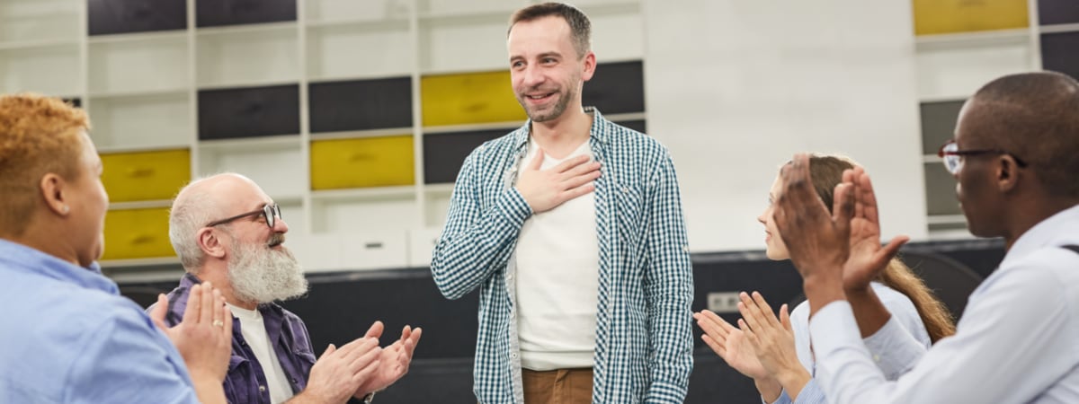 Man leading group meeting at a 12 step fellowship program offered by The Counseling Center on the east coast