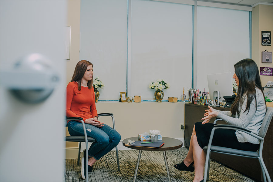 A patient female chatting with a female therapist