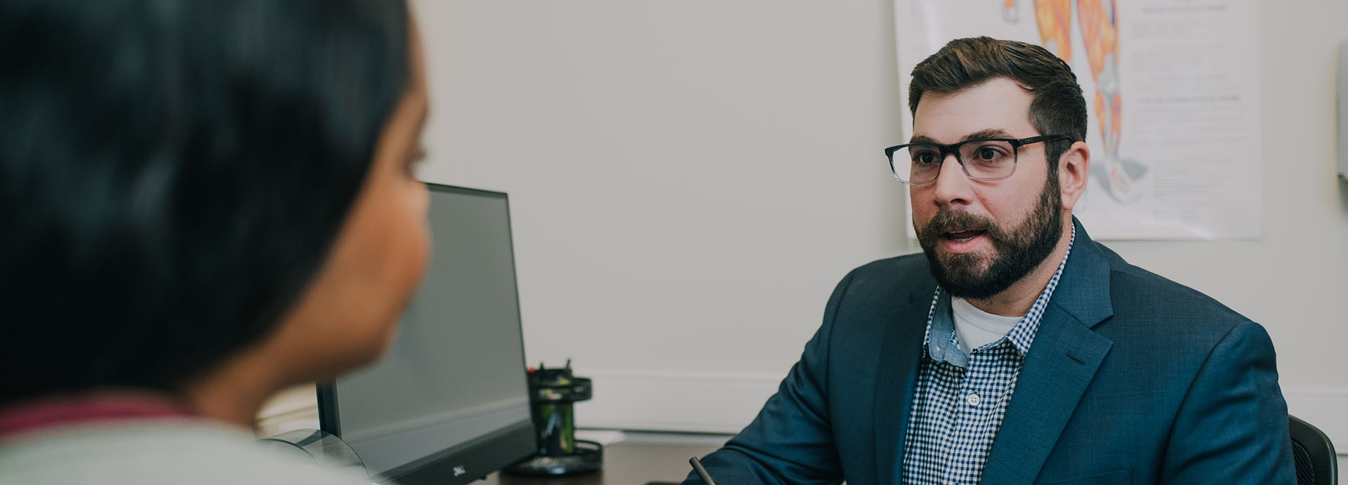A man and woman having a conversation at The Counseling Center West Caldwell